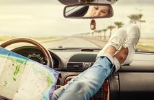 woman in car with map