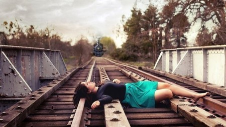 Worker lying on train track due to suicidal job