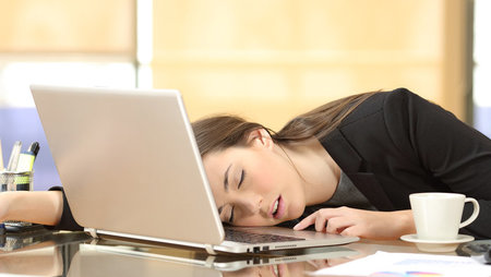 Woman sleeping at desk