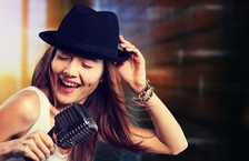 Young woman singer with microphone