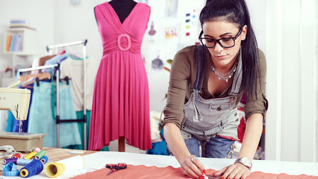 Fashion designer working on fabric