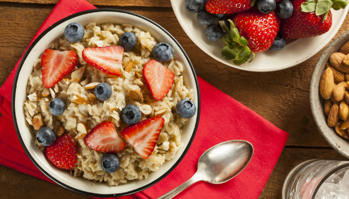 A bowl of oatmeal with berries