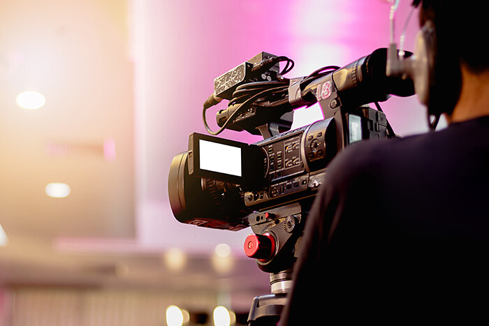 Camera operator working on a movie set