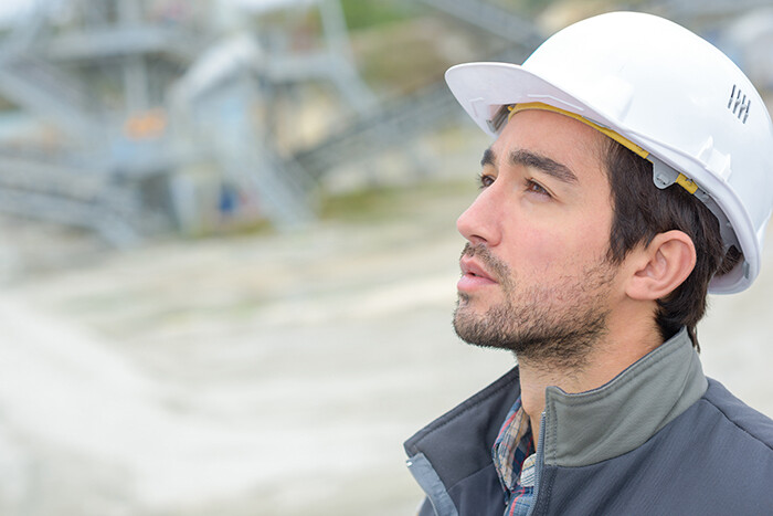 Solar power site assessor wearing a hard hat