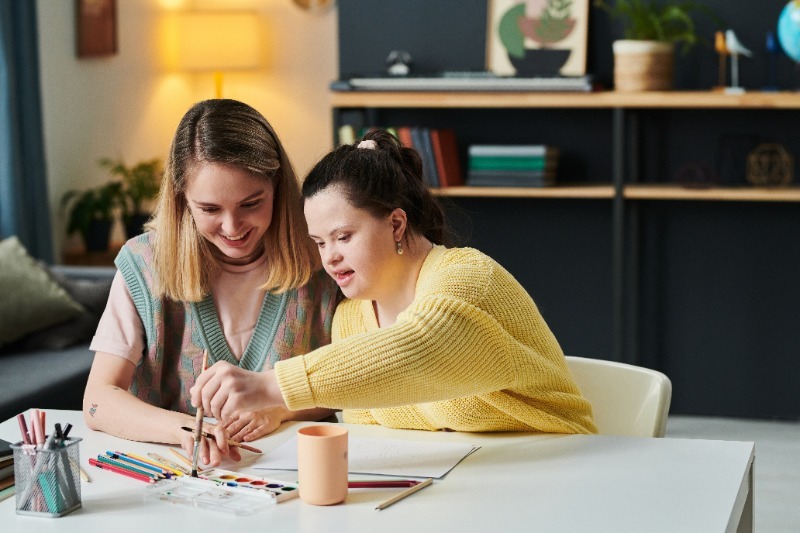 art therapist working on a creative task with a patient