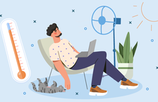 worker with a fan feeling too hot to work