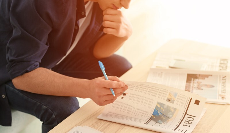searching for a new job in newspapers