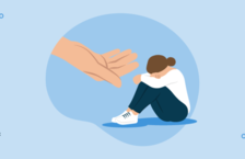 A substance abuse counselor extending their hand to a woman