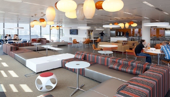 A modern break room with colourful furniture