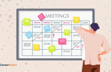 man looking at meeting board
