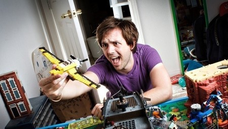 Man playing with LEGO plane